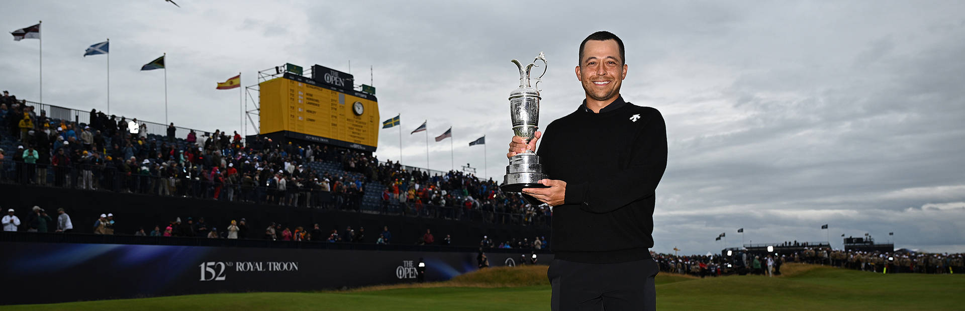 Xander Schauffele lifts the Claret Jug at Royal Troon